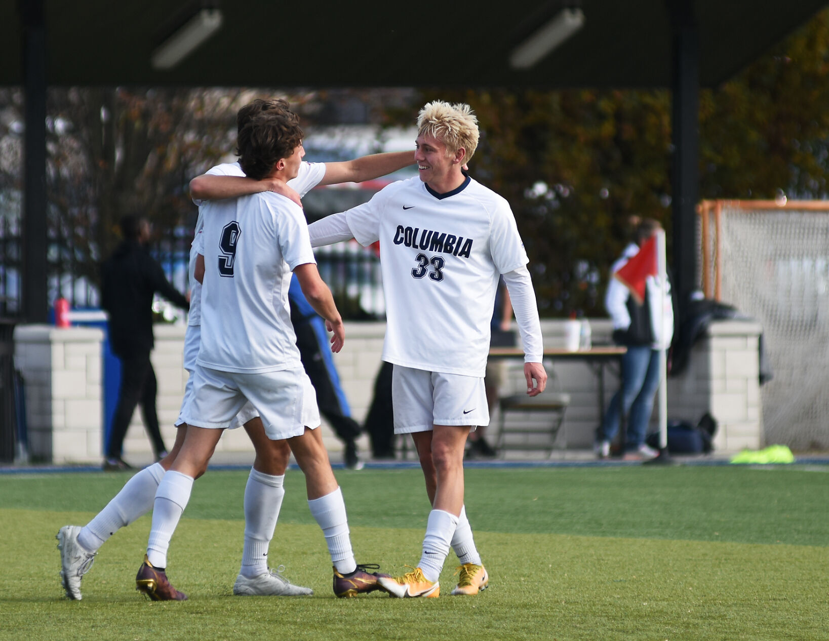 Nathan Durdle, right, hugs his teammates